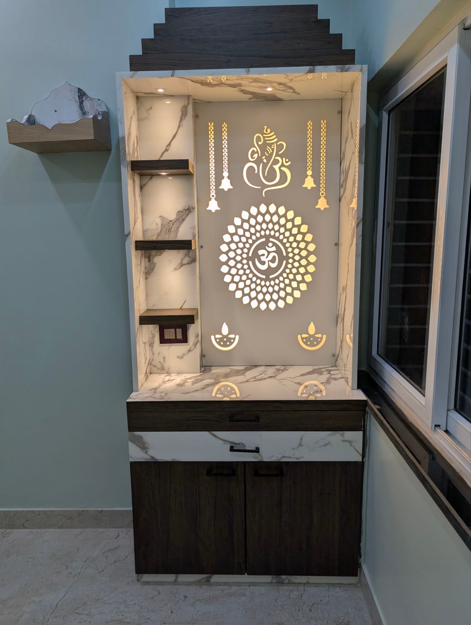 L-shaped modular kitchen with sage-grey cabinetry and patterned tile backsplash, Dumdum Kolkata